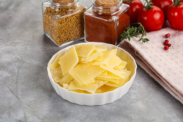 Sliced parmesan cheese in the bowl