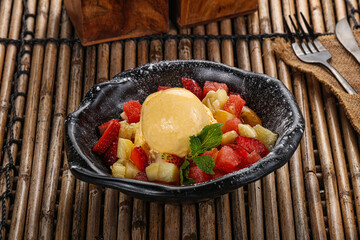 Sweet fruit salad with ice cream
