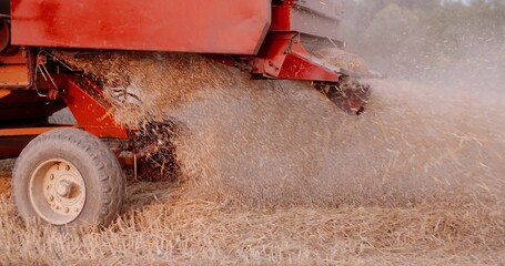 Close-up of combine harvester on field at farm