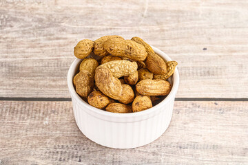 Raw ripe unpeeled peanut heap