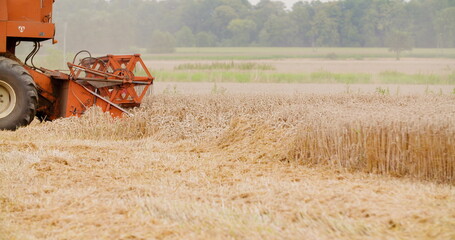 combine harvester harvesting wheat field agriculture