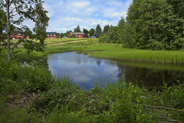 Fototapeta na wymiar Landscape in public park at the river Skellefteälven in Skelleftea, Sweden, Europe 