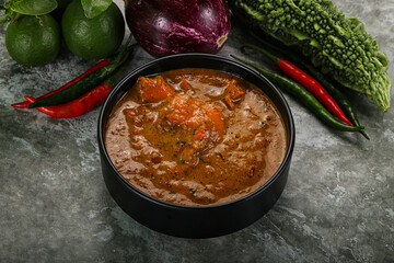 Indian cuisine - chicken curry with spices