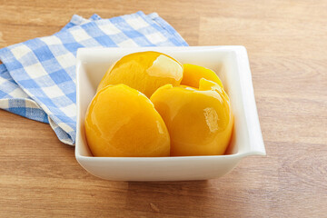 Sweet canned peaches with syrope
