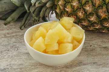 Marinated pineapple slices in the bowl