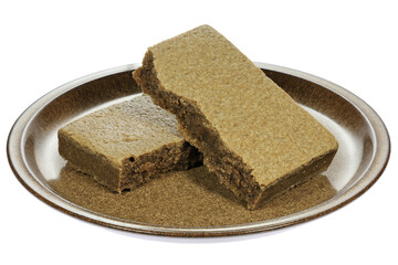 Dutch Blokzijler Brok (spiced biscuit) on a plate isolated on white background