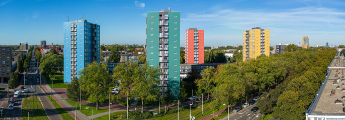 Aerial photo of 4 colorful apartment buildings in The Hague South-West on the crossing of the Dedemsvaartweg and the Melistokelaan.