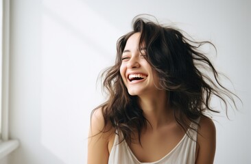 Obraz premium young woman laughing on white background