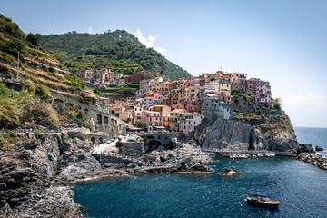 Fototapeta na wymiar View of Manarola, one of the small fishing villages of Cinque Terre, italy. A little beautiful town on a coast