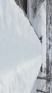 River bridge covered by snow. Aerial shoot