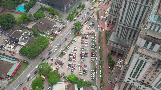 sunny day kuala lumpur downtown city traffic street car parking rooftop topdown panorama 4k timelapse malaysia