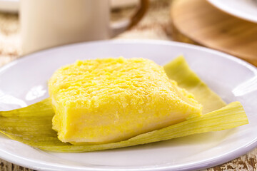Brazilian sweet corn called Pamonha, made with fuba and corn, stuffed with cheese. Served with coffee, traditional Brazilian food
