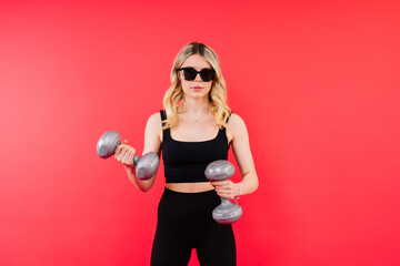 Woman, portrait and fitness, sunglasses and dumbbells, retro fashion accessory and muscle training.