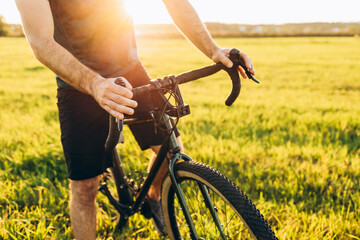 Mountain biker cycling a bike during a sunset outside. Healthy lifestyle and outdoor adventure...