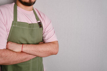 A man in a kitchen apron. Chef work in the cuisine. Cook in uniform, protection apparel. Job in...