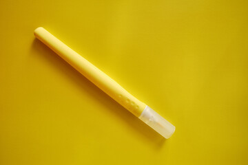 Colorful markers on a colored background, flat lay. School stationery. The concept of study, office and drawing