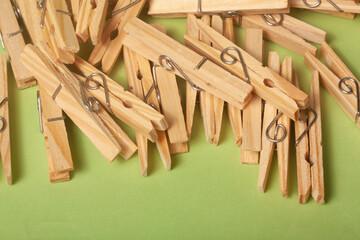 clothes clips on green background