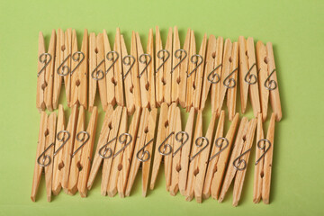 clothes clips on green background