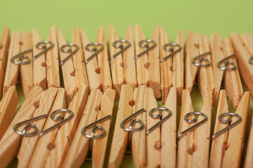 clothes clips on green background