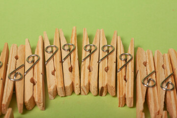 clothes clips on green background