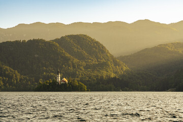 Beautiful idyllic panorama view of Lake Bled with Bled Island, Church of the Mother of God at dusk in summer, Slovenia