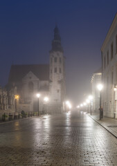 Krakow old town, St Andrew church on Grodzka street in the foggy night.