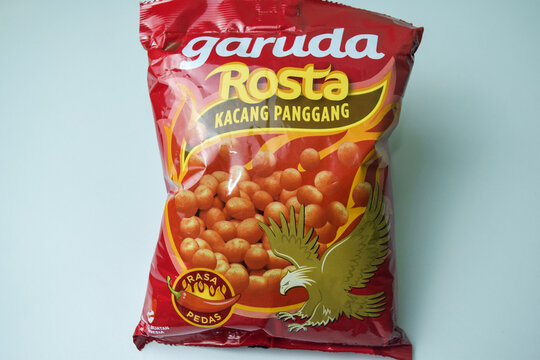 baked beans Kacang Garuda Rosta snack product on White background. Bekasi, Indonesia, December 5, 2023