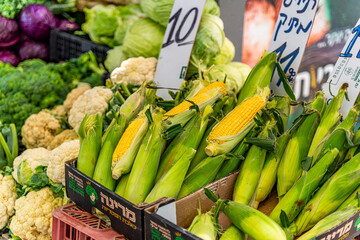 Fresh corn is sold at the Carmel market in Tel Aviv-Jaffa. - obrazy, fototapety, plakaty