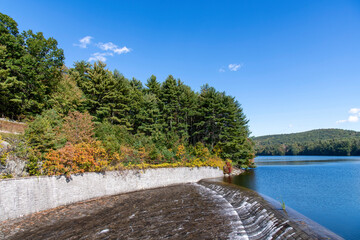 Fototapeta premium The uncontrolled spillway of the the Saville Dam and Barkhamsted Reservoir in Barkhamsted, Connecticut, USA on the eastern branch of the Farmington River