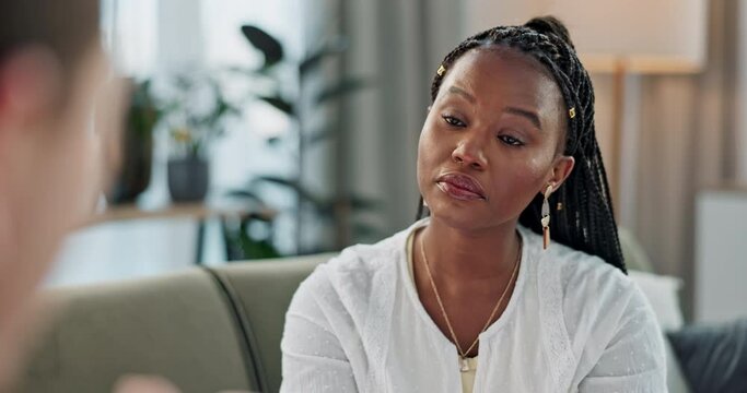 Psychology, mental health and trauma with a black woman therapist talking to a patient in her office. Support, consulting and empathy with a young psychologist listening to a client in grief therapy