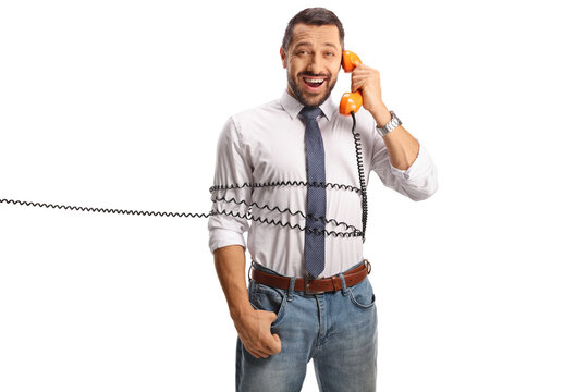 Man tied with a rotary phone cable, having a conversation and smiling