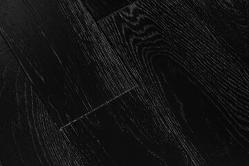 Texture of natural black oak parquet. Wooden boards for polished laminate. Background of blank hardwood floor