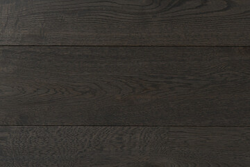 Texture of natural dark oak parquet close-up. Wooden boards for polished laminate. Hardwood sample background