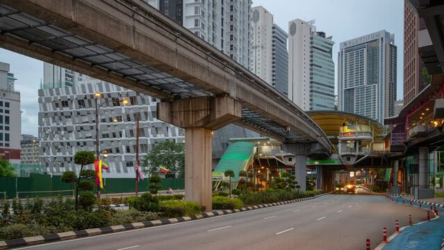 evening time illumination kuala lumpur city downtown traffic street skytrain line panorama 4k timelapse malaysia 