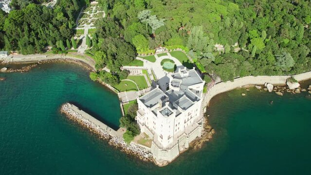 Aerial view of the Miramare Castle at the Adriatic sea coast in Italy