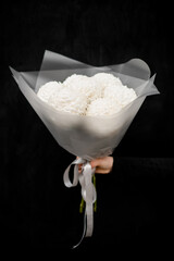 Large bouquet of chrysanthemums in a white wrapper