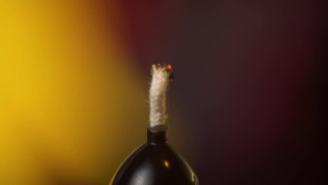 Macro shot of lighting a candle with a match