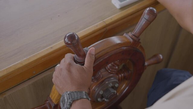 Close-Up Shot Of Man Driving Ship'S Wheel While Exploring During Vacation - Manaus , Brazil