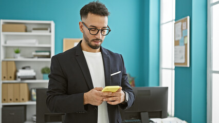 Young arab man business worker using smartphone at the office
