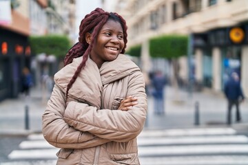 Fototapeta premium African american woman standing with arms crossed gesture at street