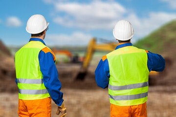 Male architects meeting at big construction site