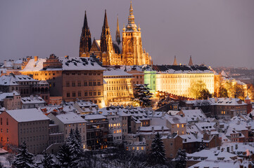 Snowy twilight captures the Prague Castle amid the winter glow. Prague, Czech Republic
