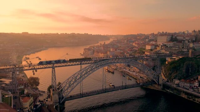 Aerial view of Porto with Luis I Bridge and Douro River at sunset. High quality 4k footage