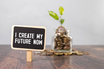 Text I CREATE MY FUTURE NOW on sticky notes with copy space and paper clip isolated on red...