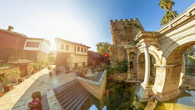 Historic gate at Antalya city's entrance, Hadrian's Gate in Turkey. Remarkably preserved marble archway, showcasing Roman architectural elements, serves as magnificent testament to archaeological past