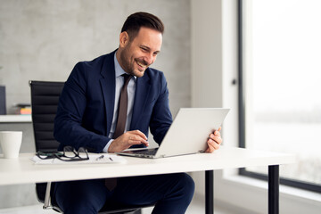 Fototapeta premium Portrait of businessman working in his office in building