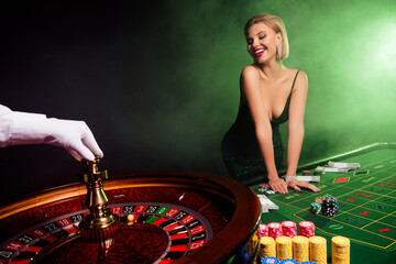 Photo of happy stunning gorgeous girl in vip casino club enjoy her victory playing with fortune...