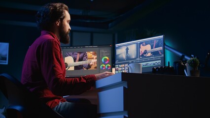 Video editor arrives at work, ready to start analyzing film montage before editing color grading...