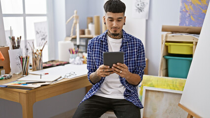 Creative explosion, young latin artist masterfully wielding touchpad for a digital art class,...
