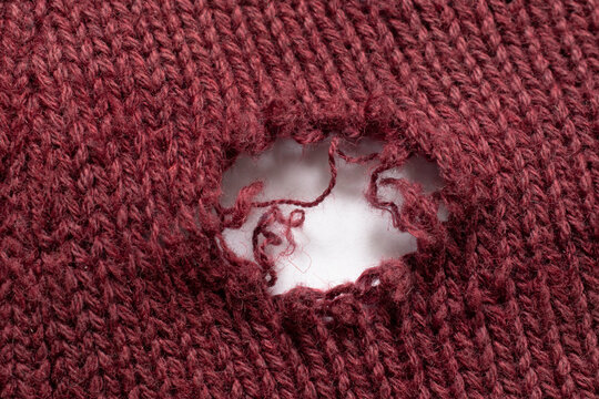 old wool sweater with holes